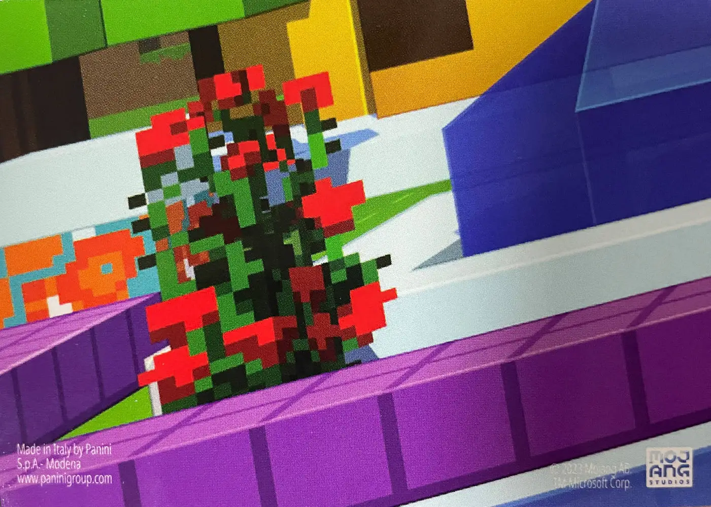 Alex uses colourful carpets, banners and flowers to brighten up the blacksmith's house (Pixel) card back